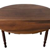 Oval walnut table with flaps