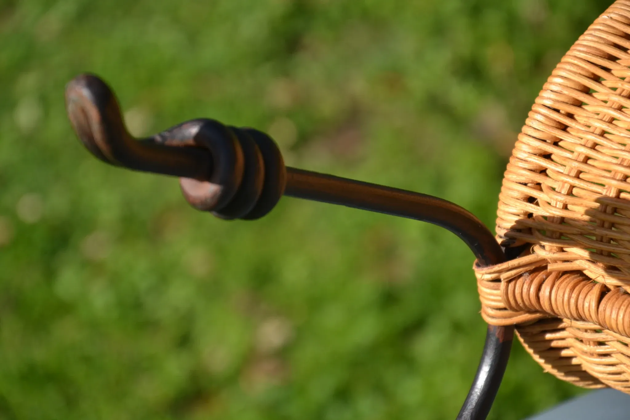 Wrought iron and rattan magazine/newspaper rack
