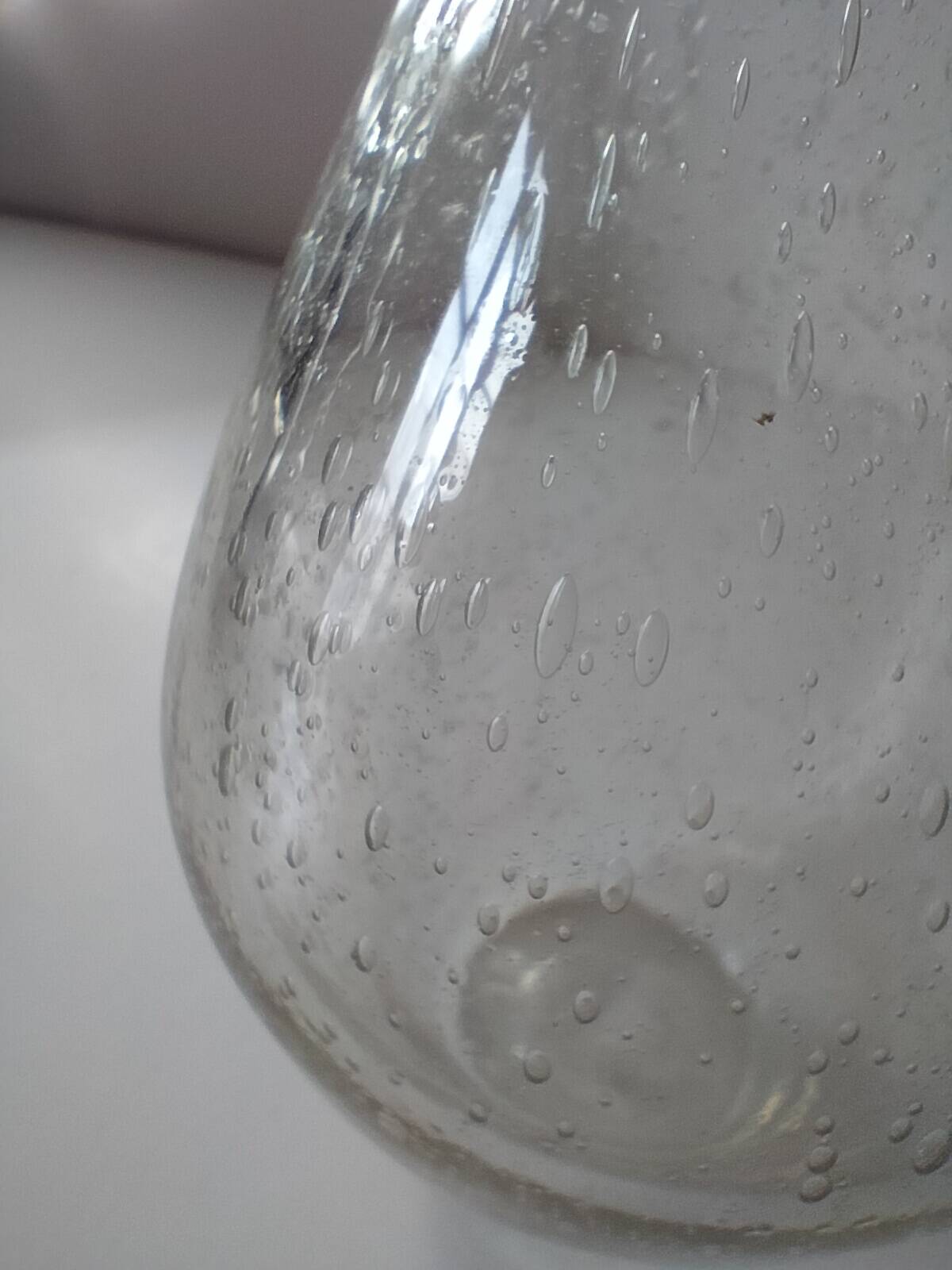 Bubble glass carafe bottle signed Biot in lime green colour.