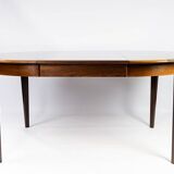 Dining table in rosewood with two extension plates, of danish design from the 1960s.