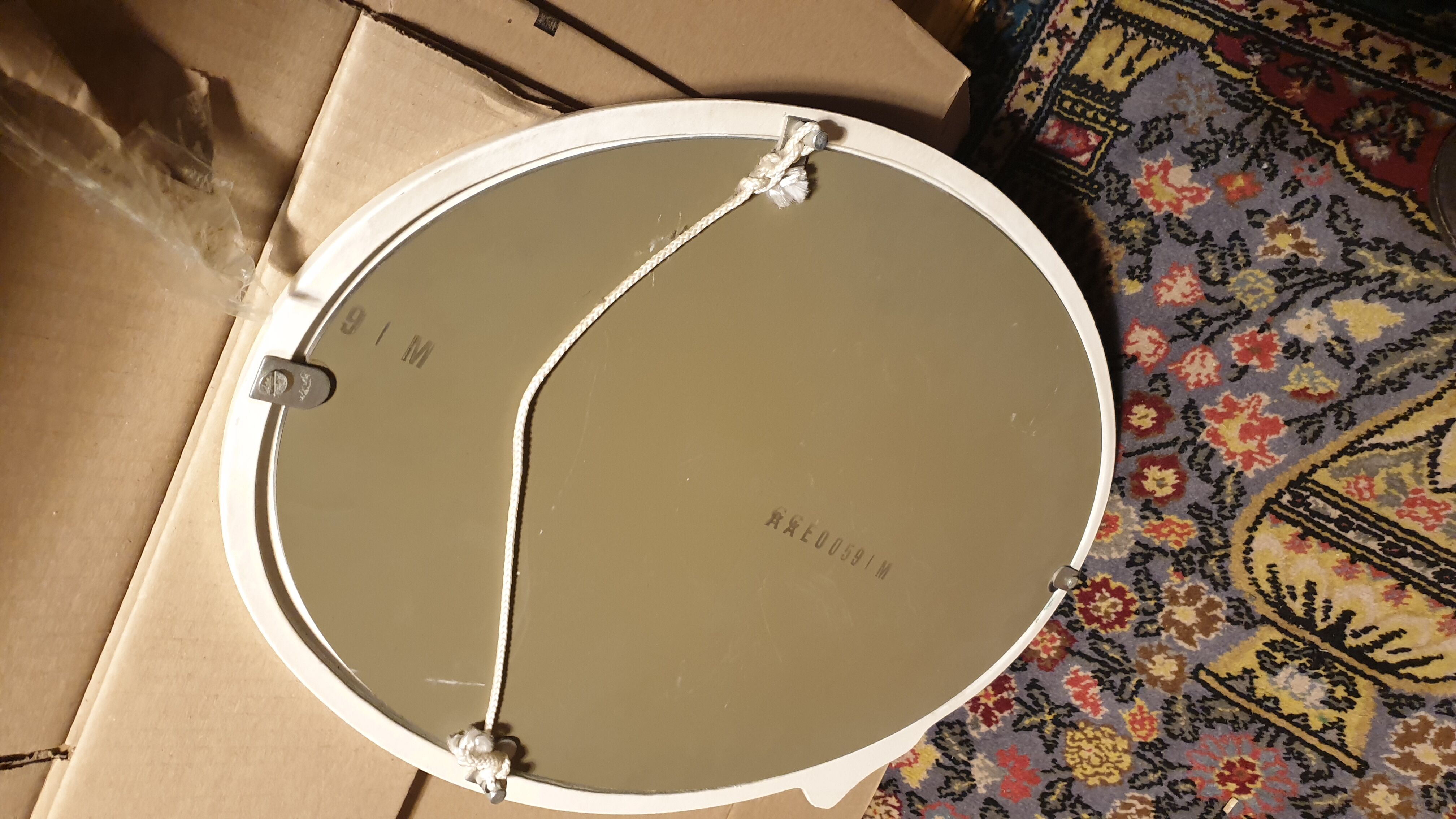 Oval cast iron mirror