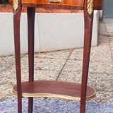 Louis XVI period pedestal table, in solid mahogany and veneer, and in gilded bronze.