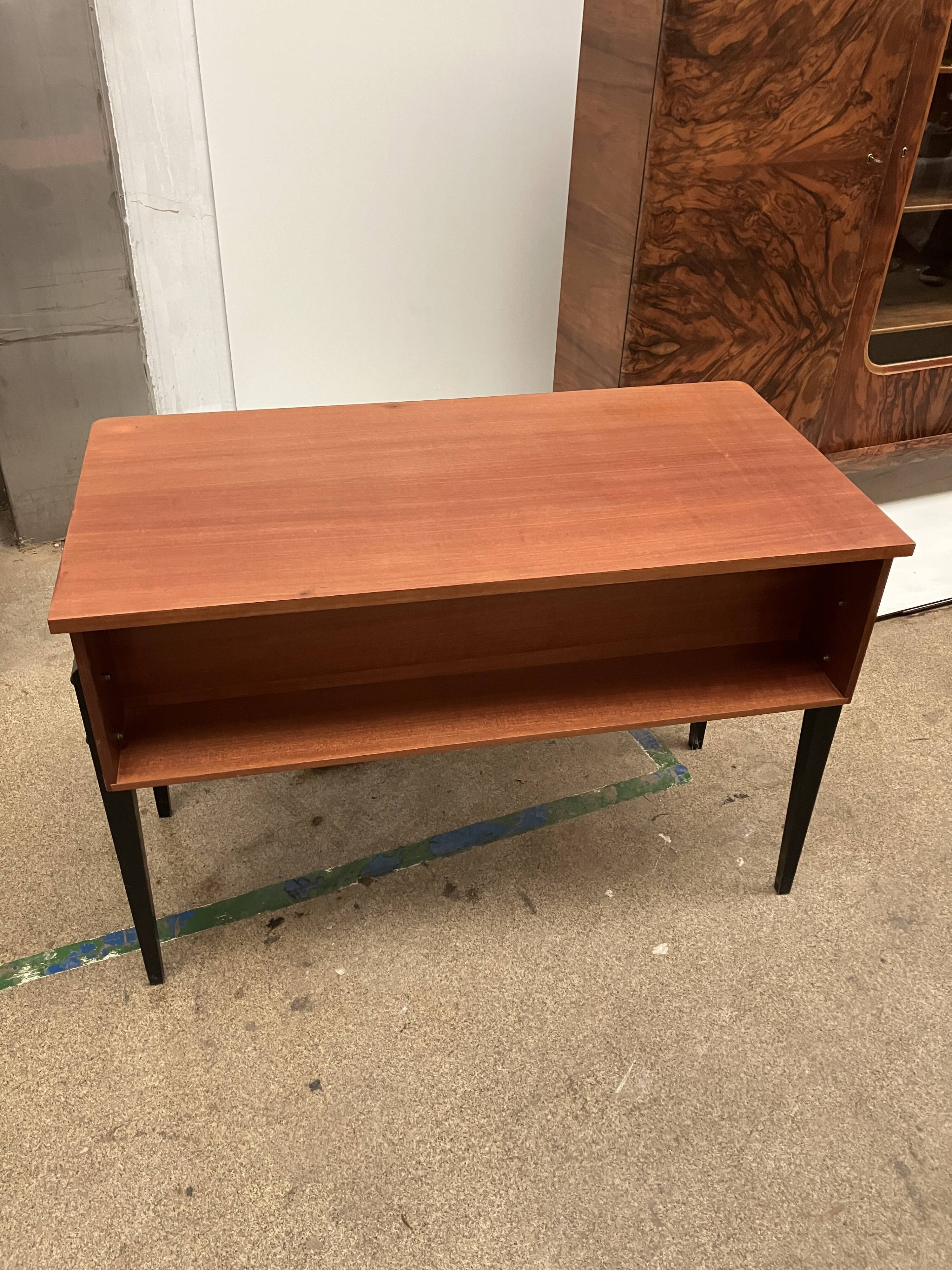 Elegant vintage desk with black legs made in the 60s