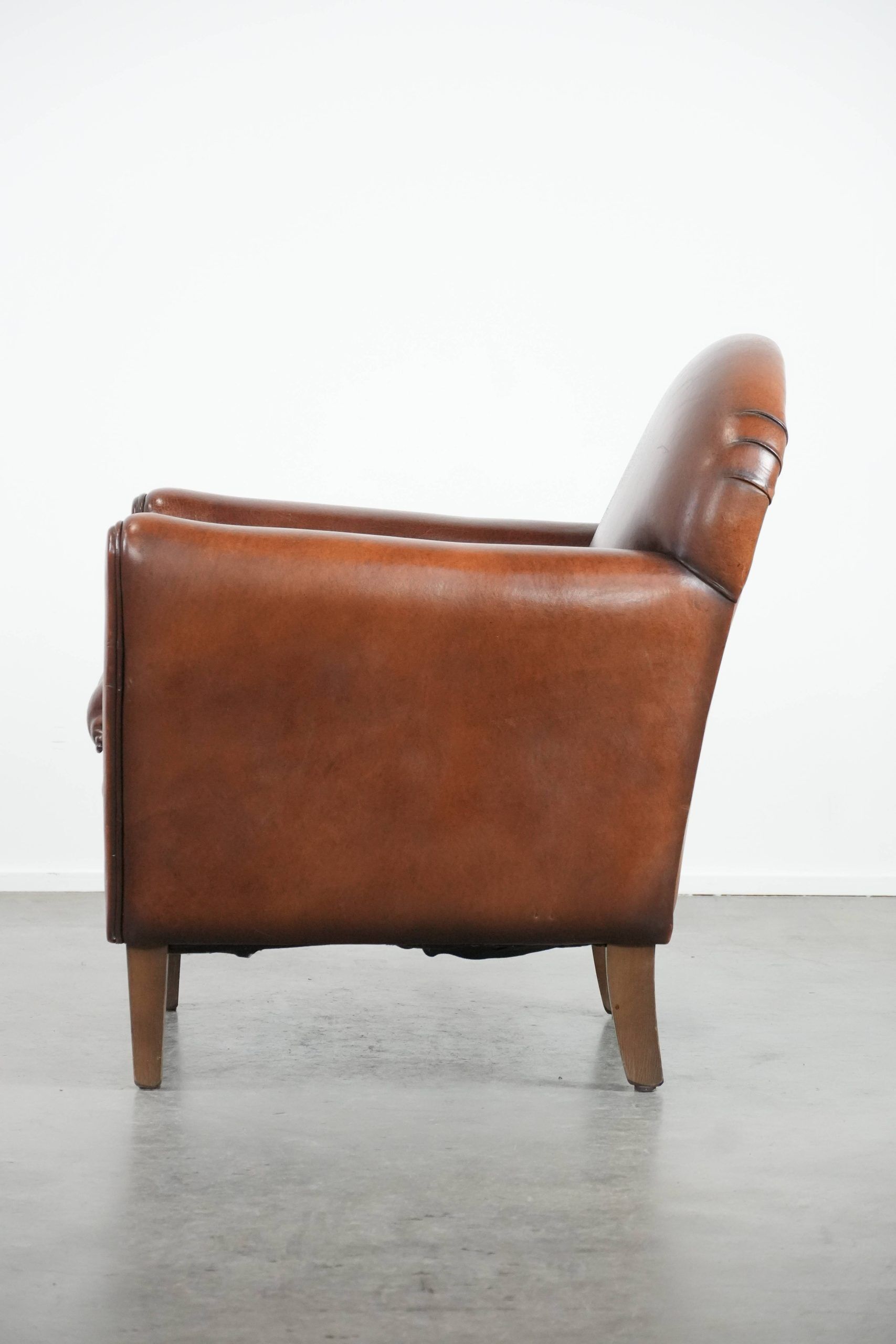 Armchair made of sheepskin leather in art deco design with warm colours