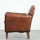 Armchair made of sheepskin leather in art deco design with warm colours