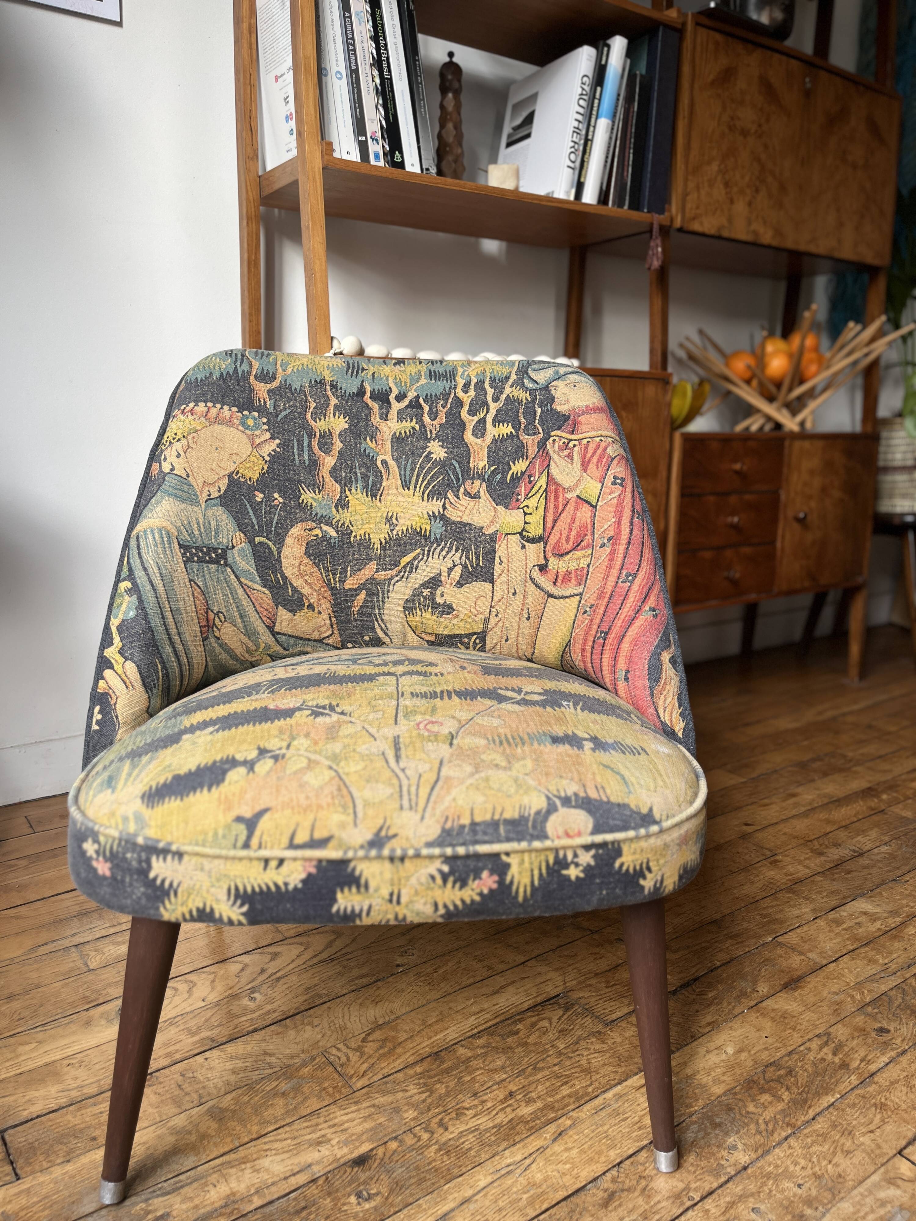 J. Tenreiro, Brazil. Concha armchair with tapered legs, Cluny tapestry 1400.