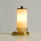 A beautiful, rare 1950s brass table lamp with one opal glass shade adorned