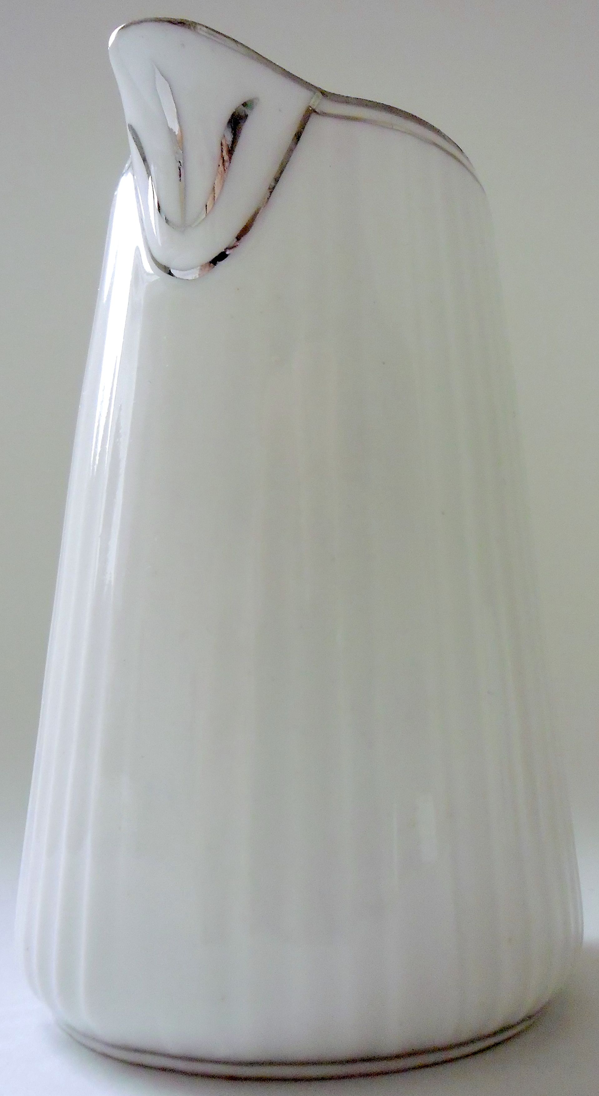 Pair of creamers in white porcelain enhanced with platinum