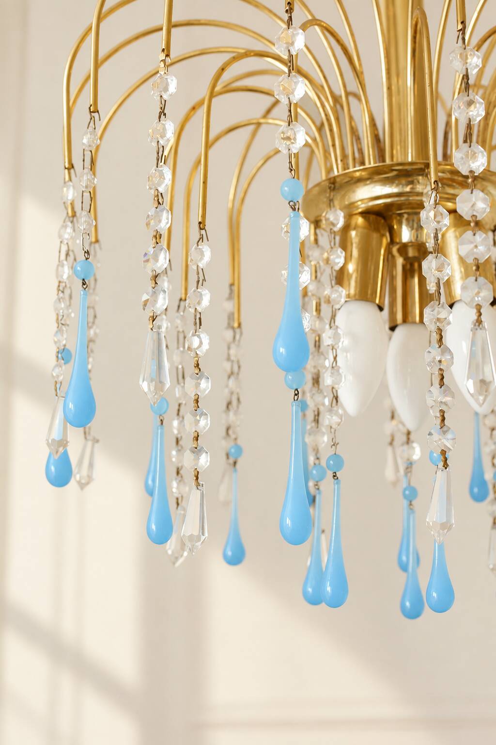 Vintage chandelier with blue Murano glass pendants.