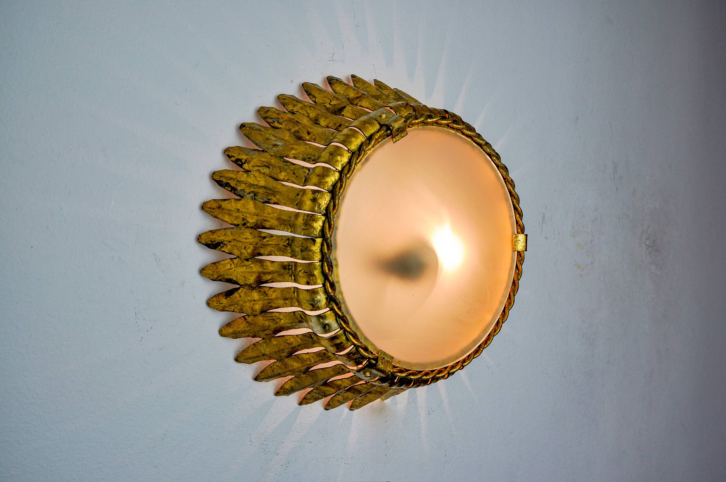 Sun wall lamp by ferro arte, metal and gold leaf, Spain, 1960