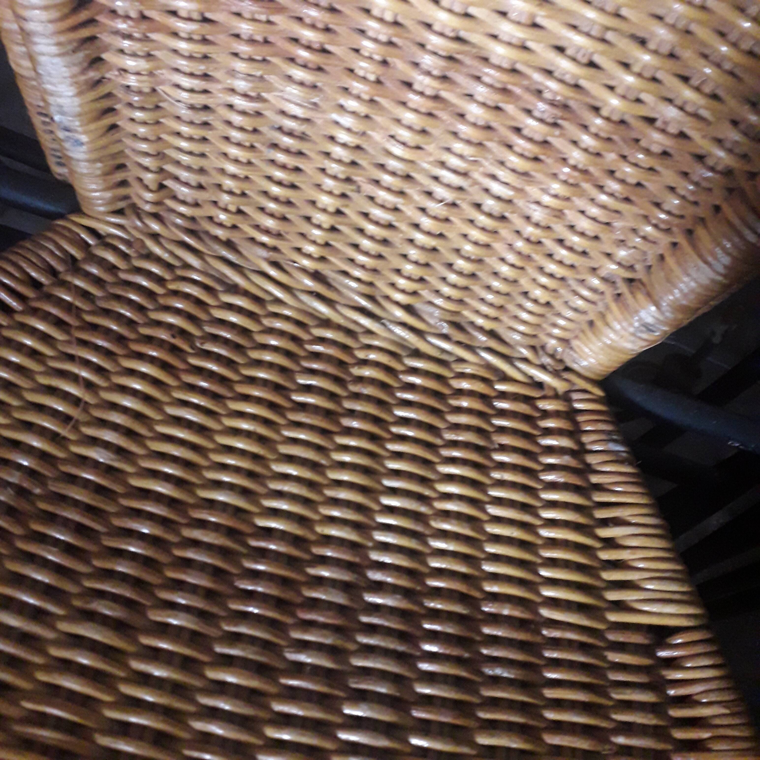 4 vintage wrought iron rattan chairs.