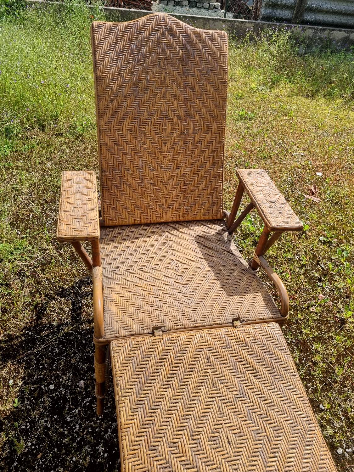 Old vintage rattan lounge chair