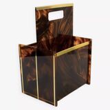 Tortoiseshell lucite magazine rack from the Christian Dior Home collection.