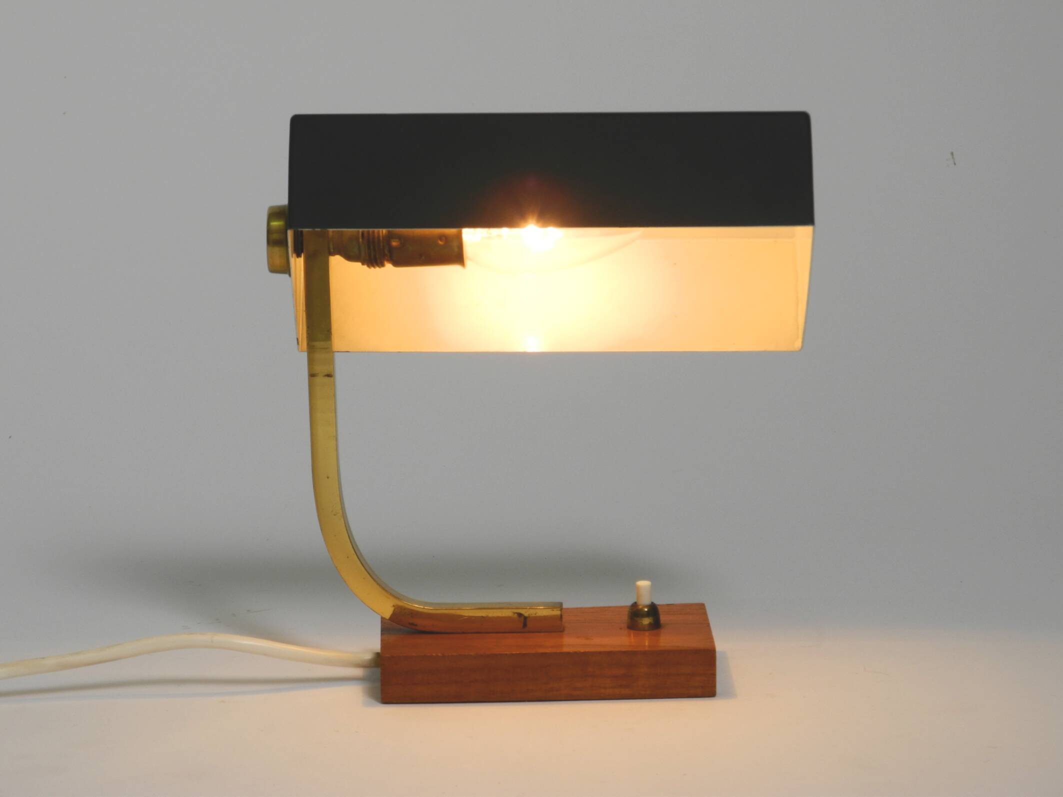 Beautiful small Mid Century Modern metal and brass table lamp with teak bas