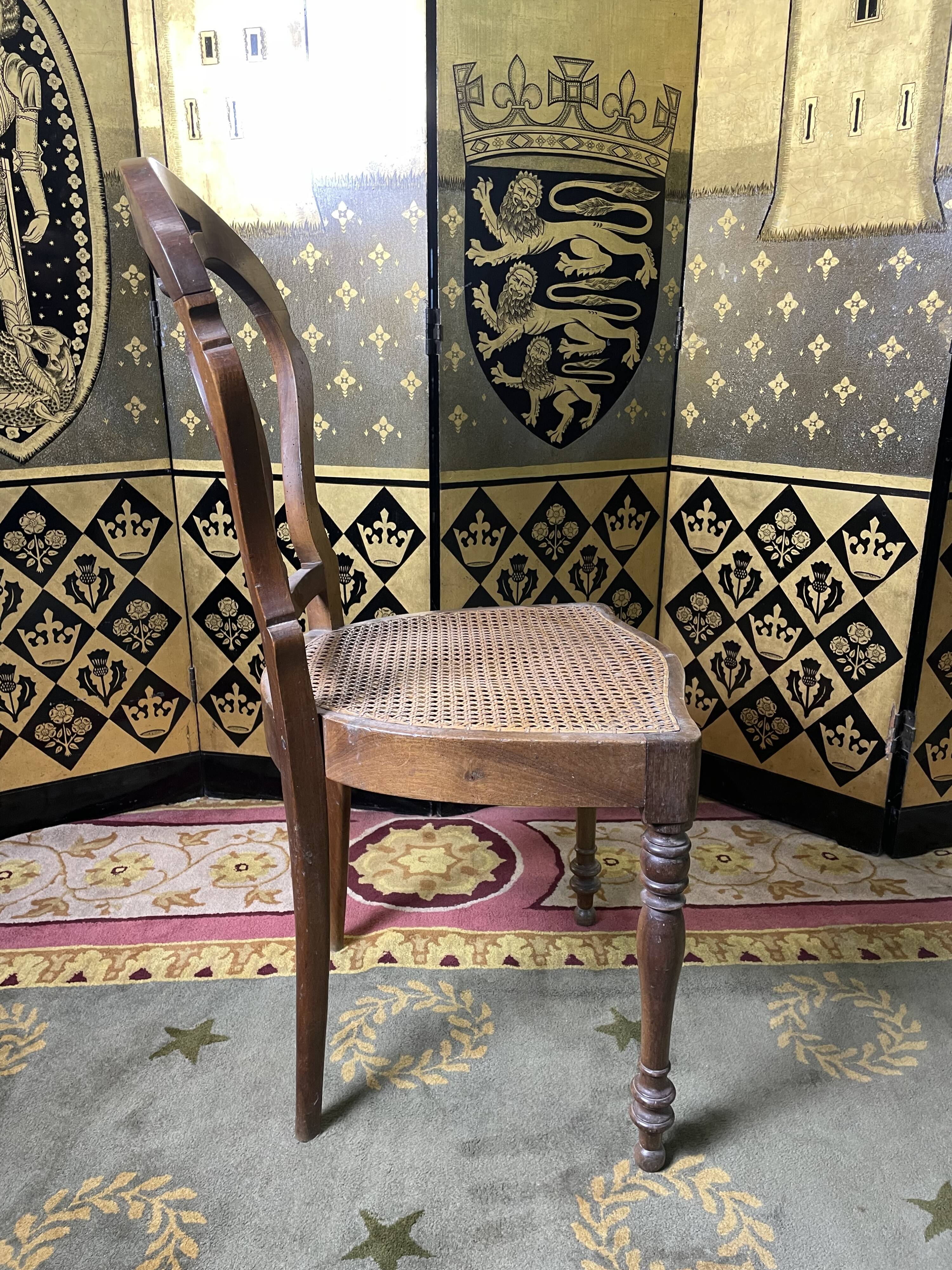 Suite of 12 Louis Philippe period chairs in walnut and canning