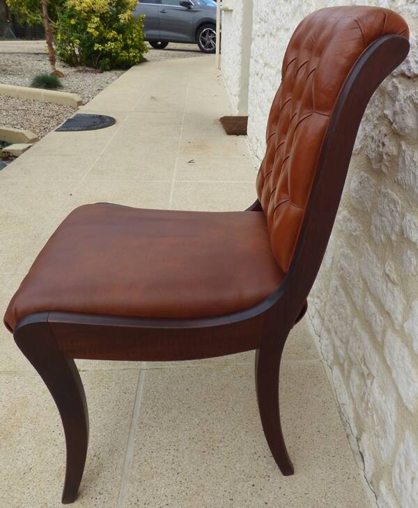 Chic Vintage Chesterfield style chair with wooden frame and faux leather