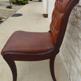 Chic Vintage Chesterfield style chair with wooden frame and faux leather