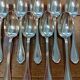 Set of 12 silver-plated metal soup spoons