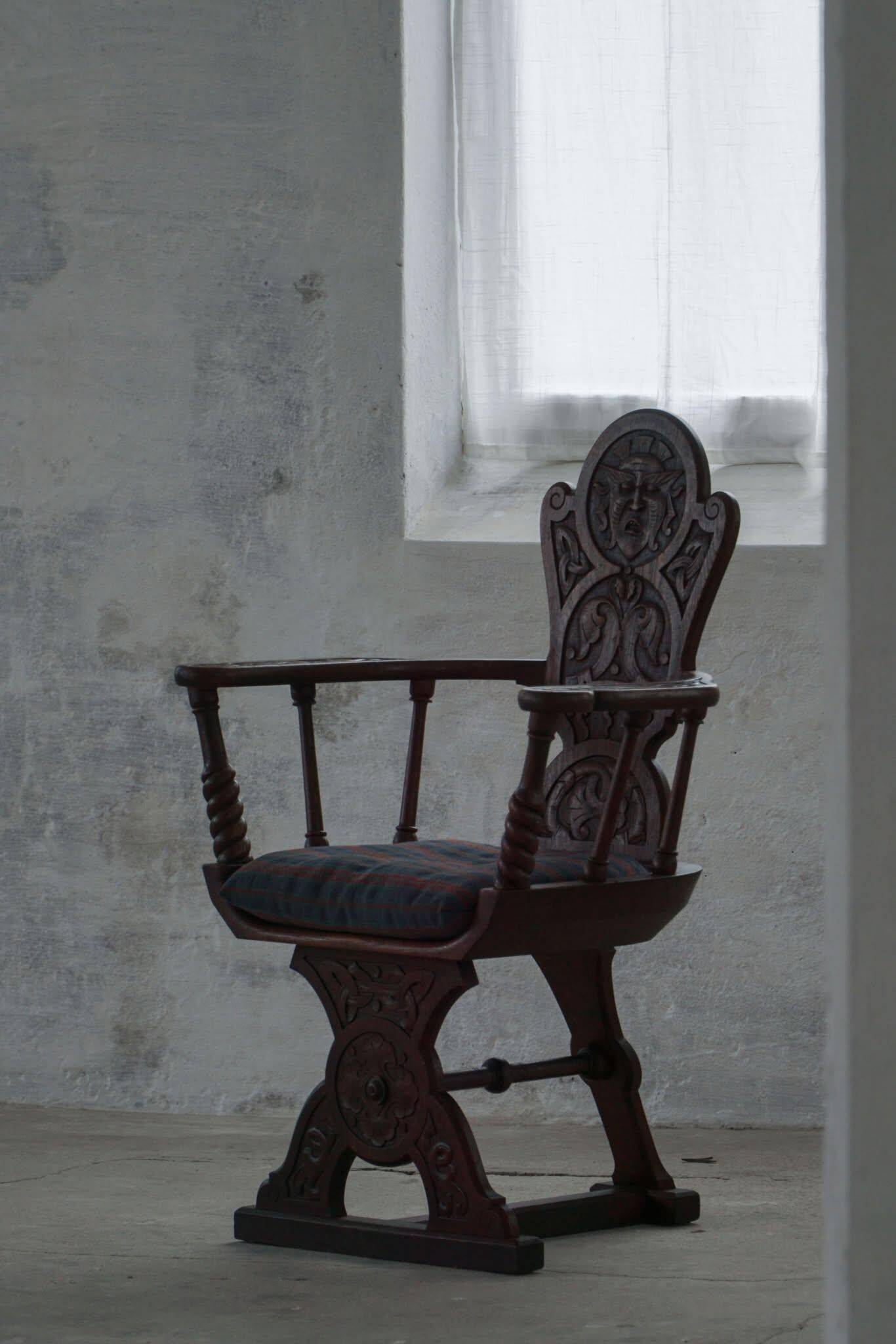 Scandinavian armchair in solid oak with cushion, folk art, early 19th century.