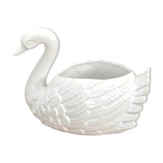 vintage porcelain flower pot in the shape of a swan