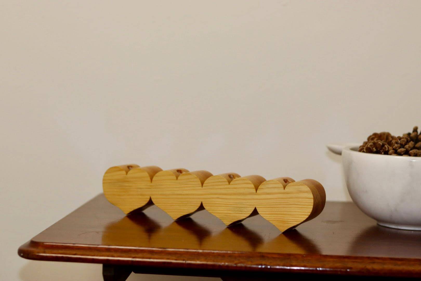 Heart-shaped chandelier made of Swedish pine wood.