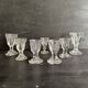 Set of antique liqueur glasses in thick glass, bistro style.