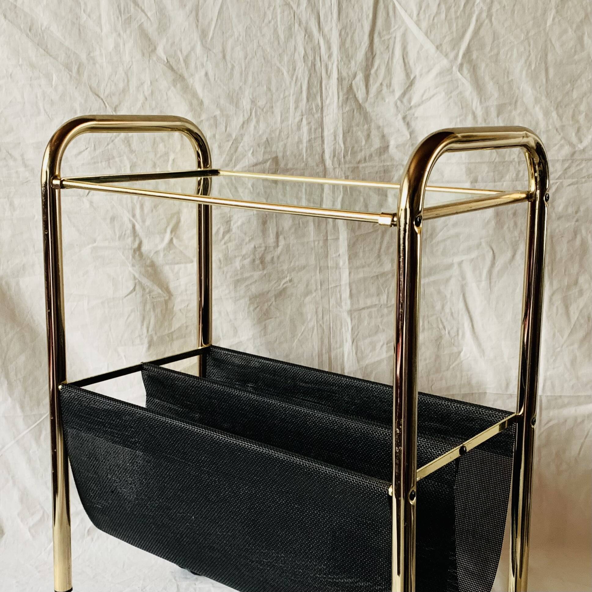 Magazine rack, saddle on vintage wheels