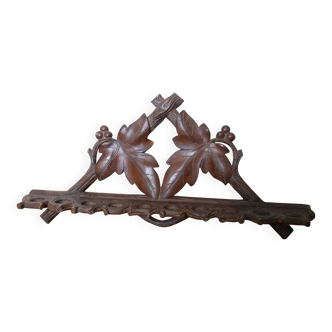 Carved wooden pipe holder