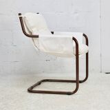 Tubular armchair, fabric suspended seat. Circa 1970