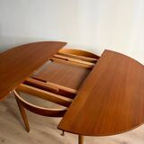 Vintage Scandinavian round table from the 50s and 60s in extendable teak with ra.
