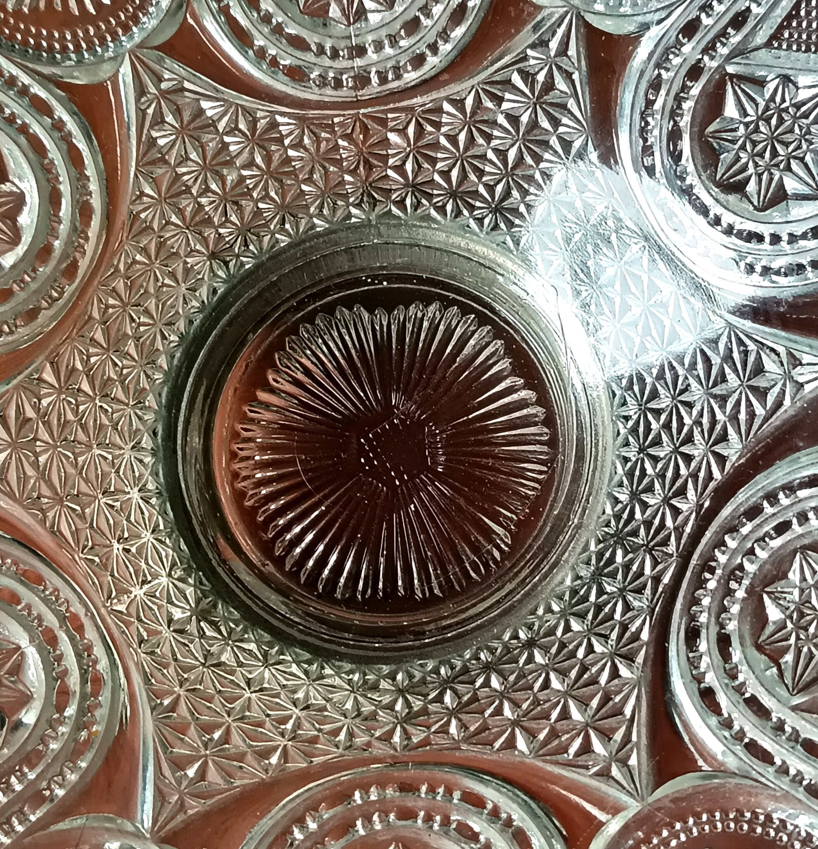 Transparent glass dish on vintage metal stand
