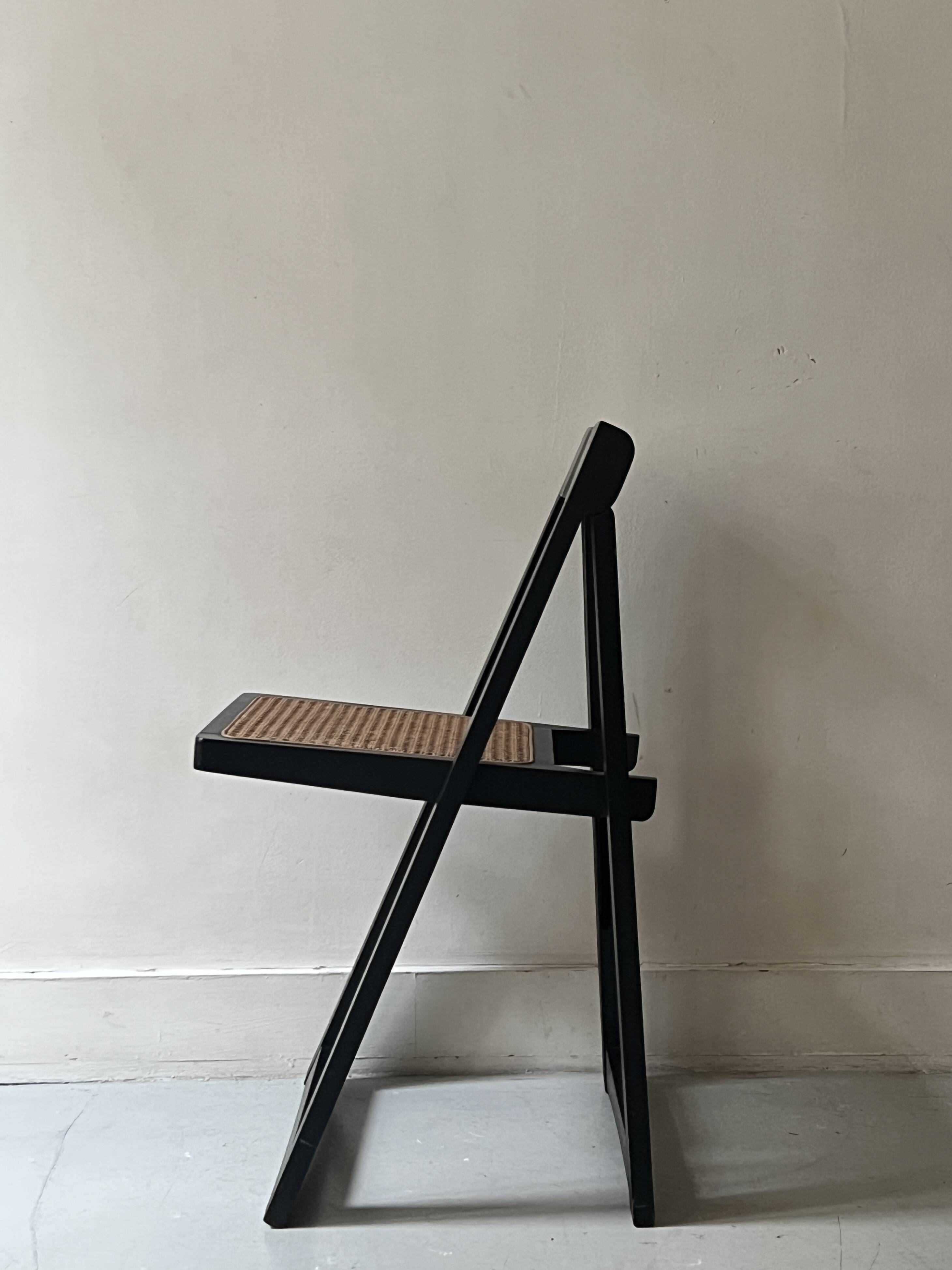 Folding designer chair in black wood and caning, Aldo Jacober 1970