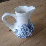 Small old pitcher in iron earth