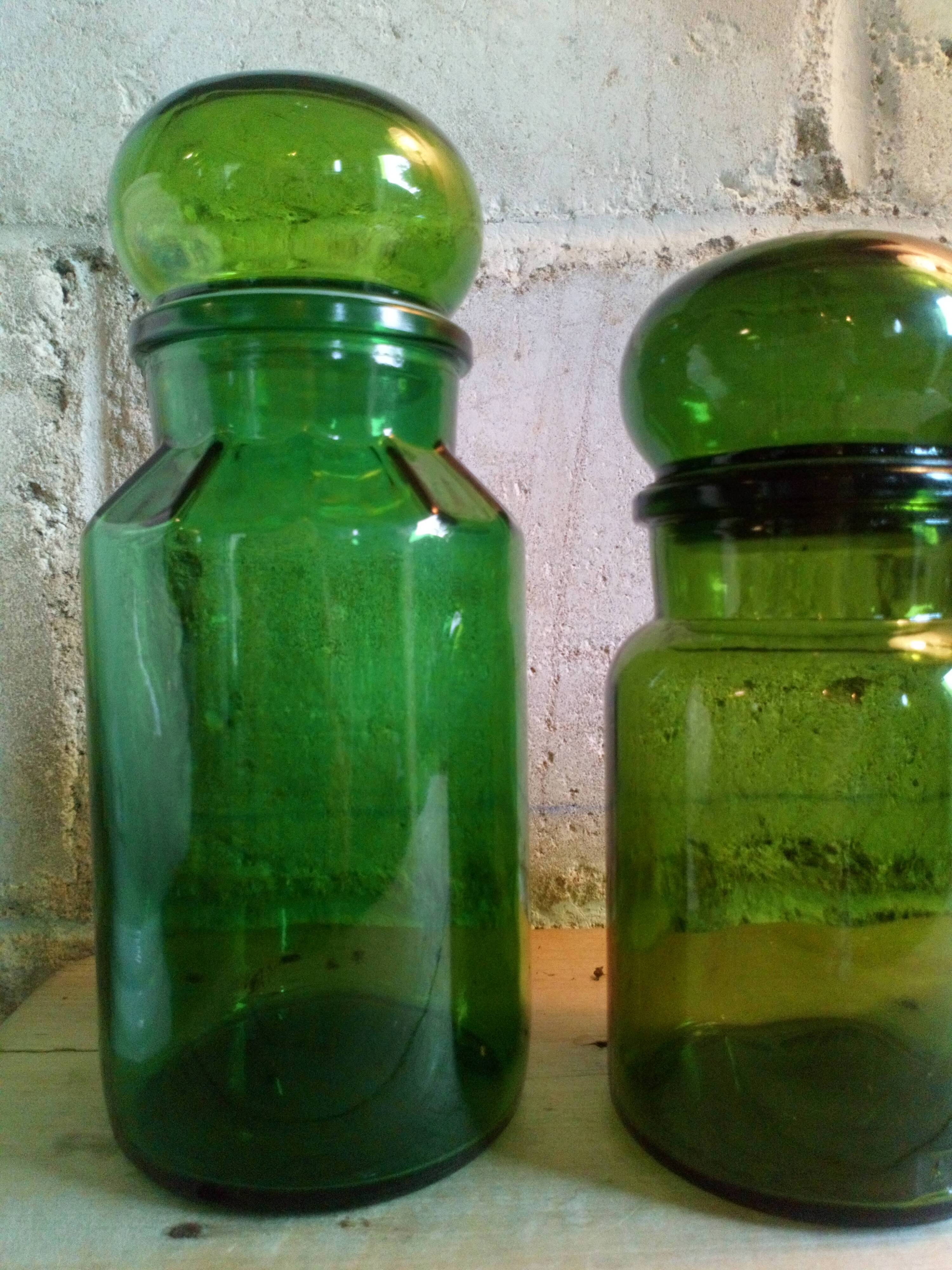 Trio of green glass apothecary bottles