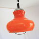 Suspension goes up and down from the kitchen, orange blown glass.
