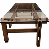 Glass coffee table with a wooden frame.