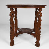 Asian coffee table carved with dragons and peacocks, Indonesia, early 20th century