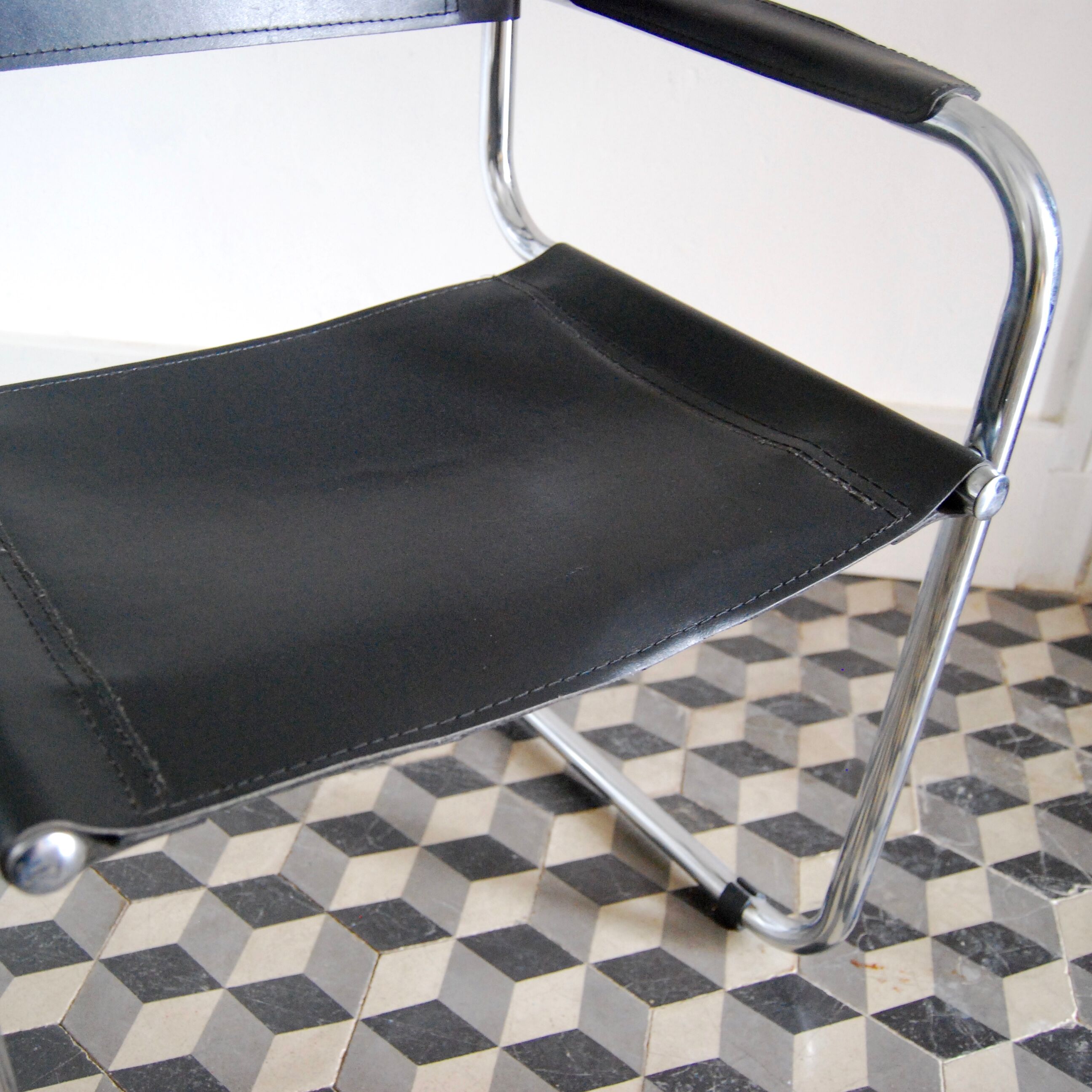 Vintage chrome and faux black leather armchair