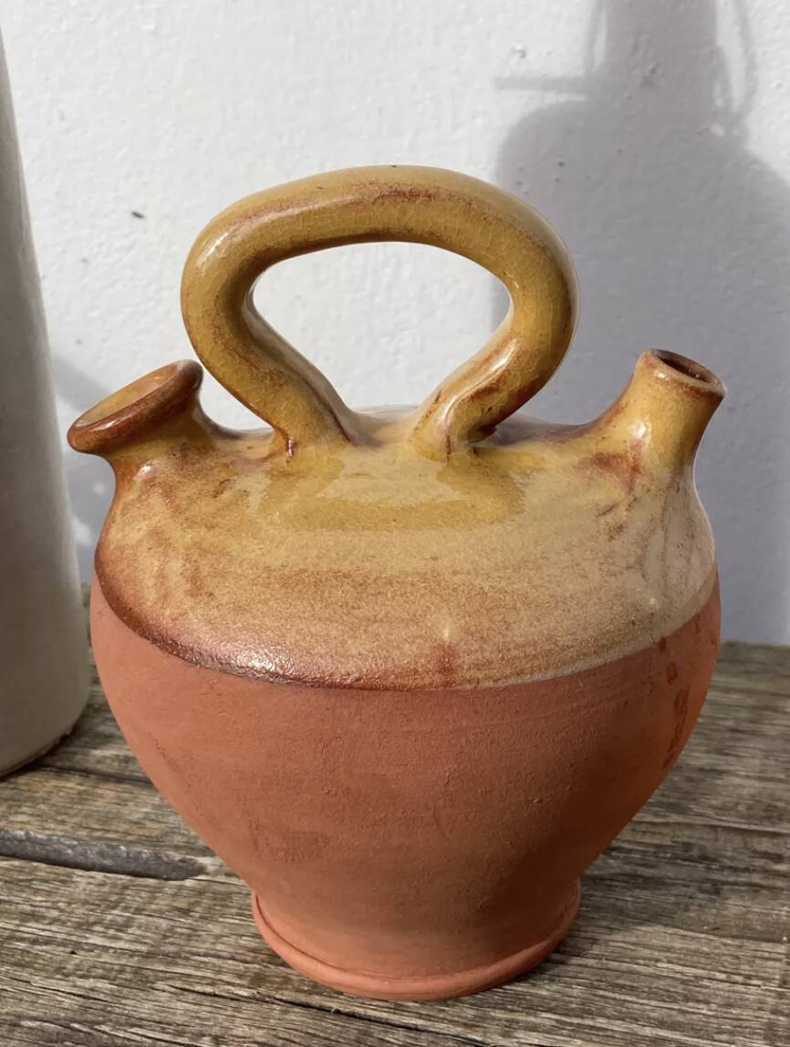 Gargoulette or old jug in yellow glazed terracotta