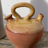 Gargoulette or old jug in yellow glazed terracotta