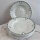 Set of 7 deep plates in earthenware, decorated with a green frieze.