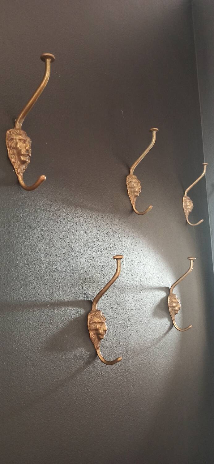 Set of 5 antique "Lion Head" coat hooks.