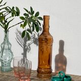 Vintage amber bottle in patterned brown glass