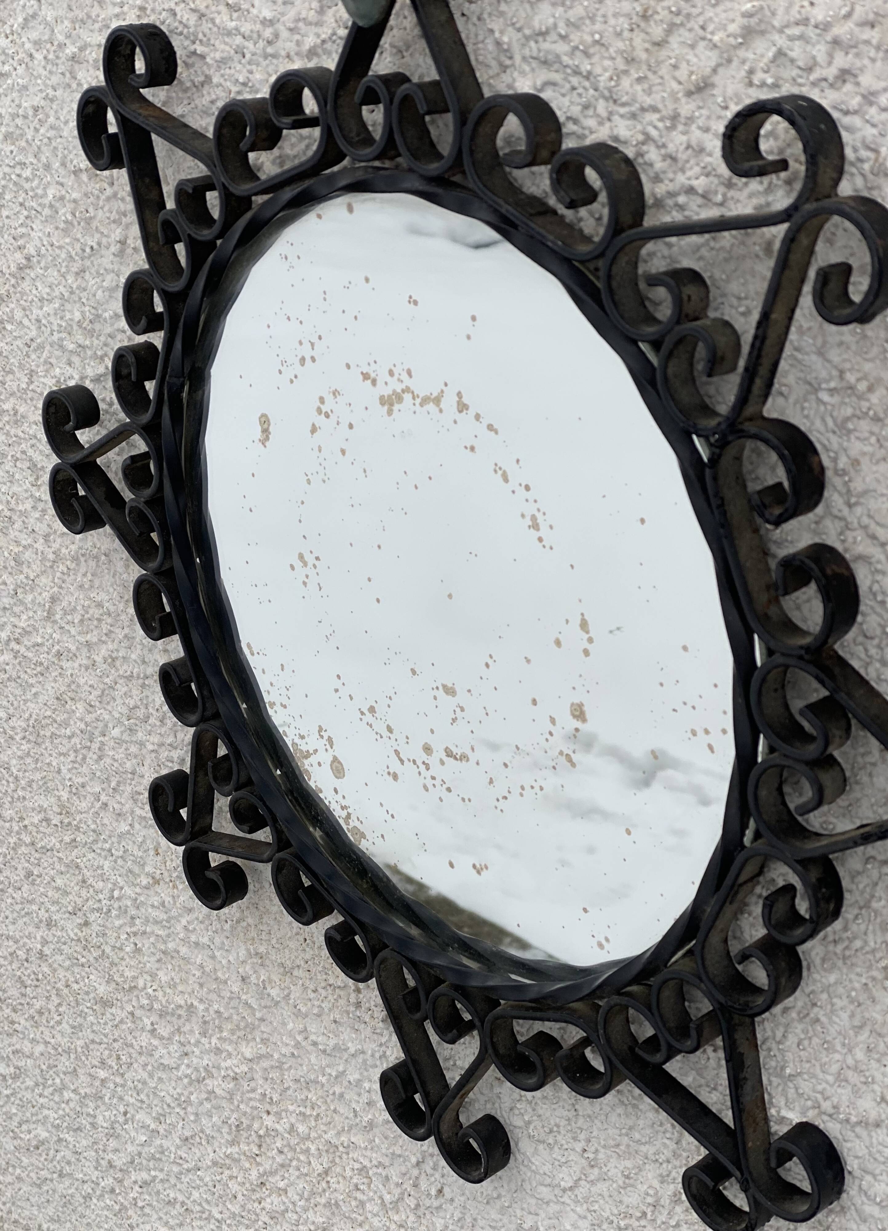 Vintage 1950s round metal mirror in the style of Chaty