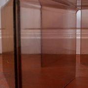 Vintage trio of nesting tables in smoked plexiglass by Michel Dumas, year.