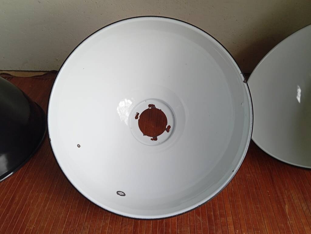 Set of 10 large industrial enamelled metal pendants.