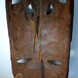 Enigmatic face of Africa carved in ebony wood