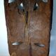 Visage énigmatique d'Afrique sculpté en bois d'ébène