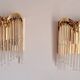 Pair of gold metal wall lights with tassels