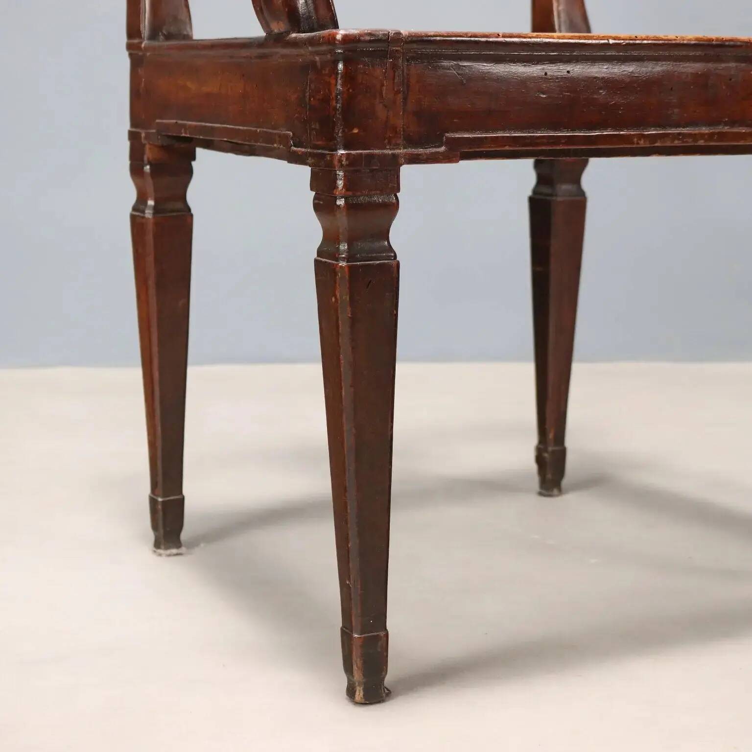 Antique walnut armchair with caned seat, Italy, 18th century